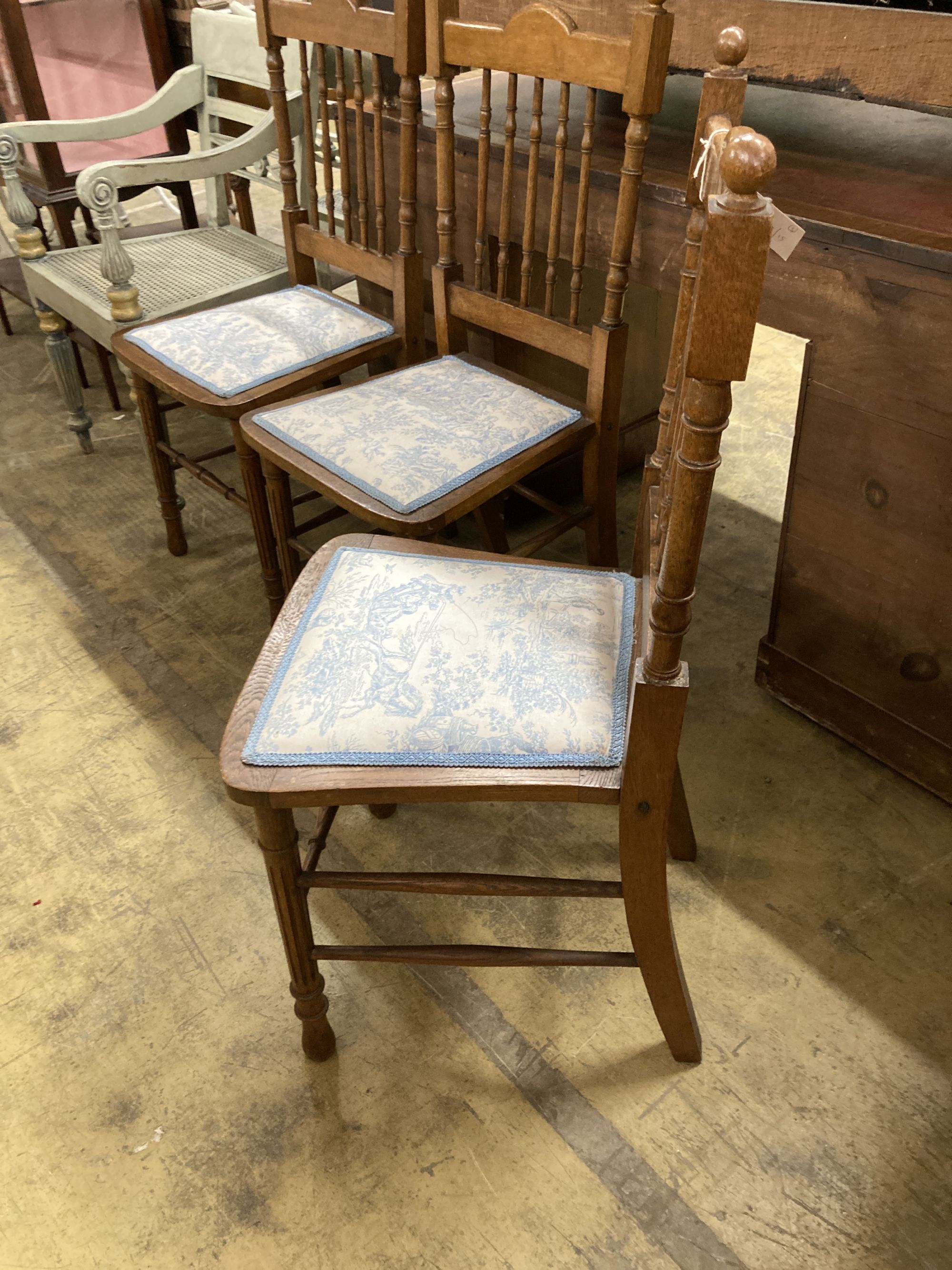 Three oak dining chairs